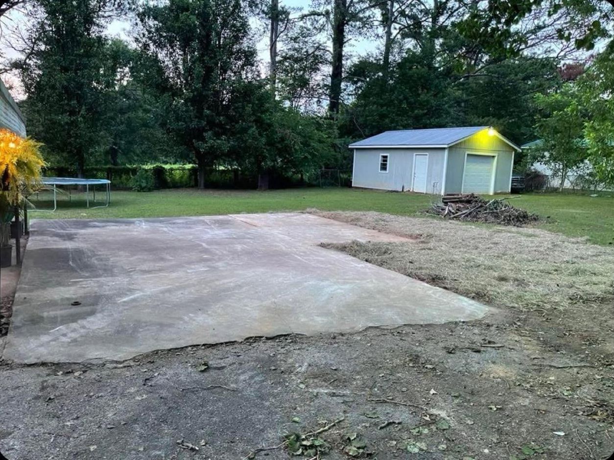 After: the house removed, slab swept clean and yard cleared