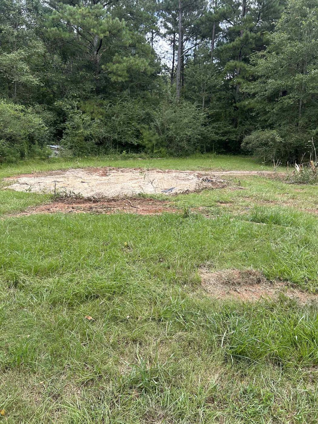 Cleared pad where a metal pool was removed