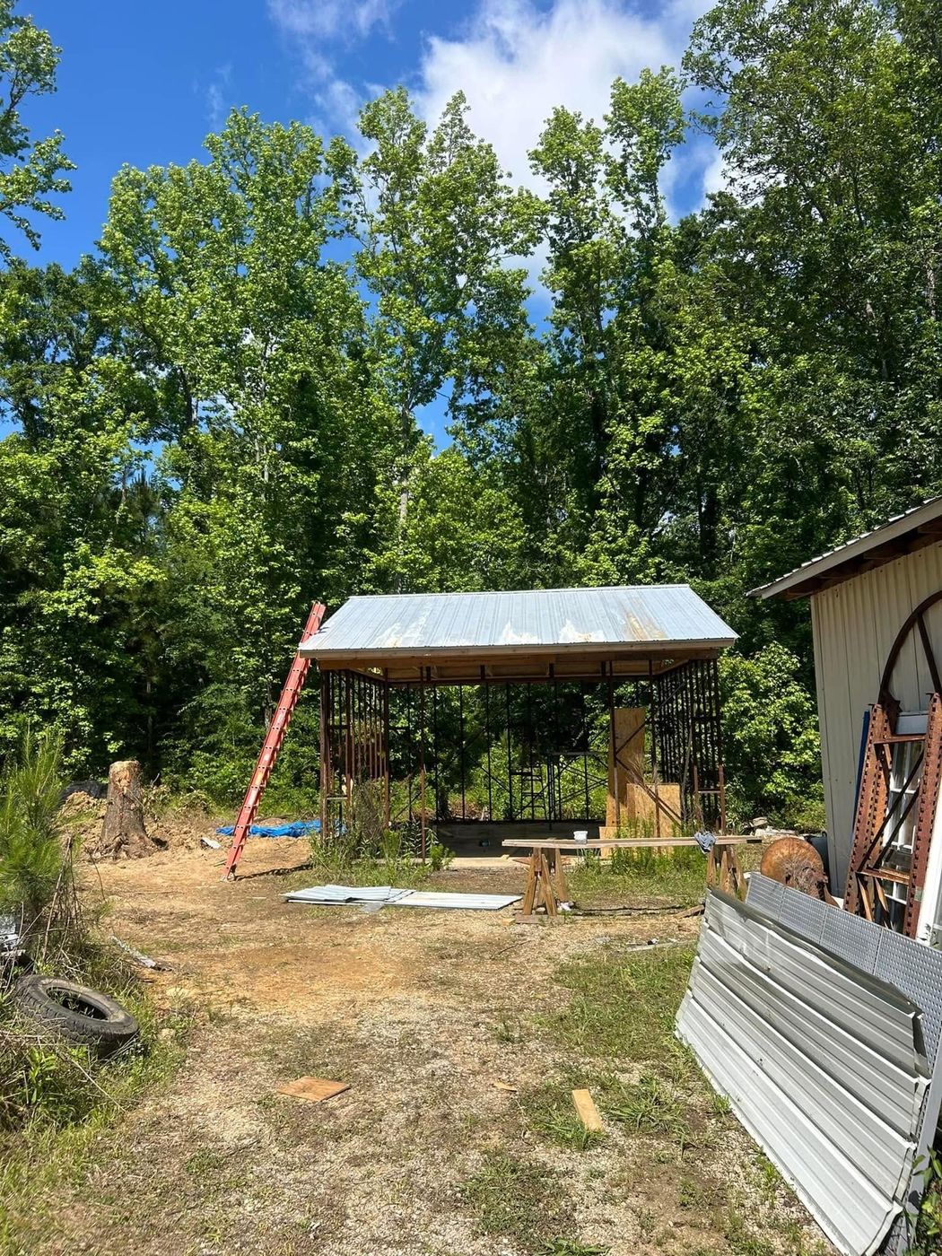 The pole barn's old steel skeleton with the roof back on