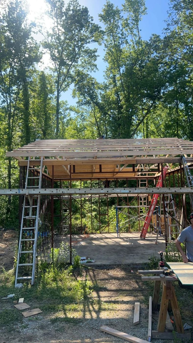 Roof framing done, trusses and purlins set